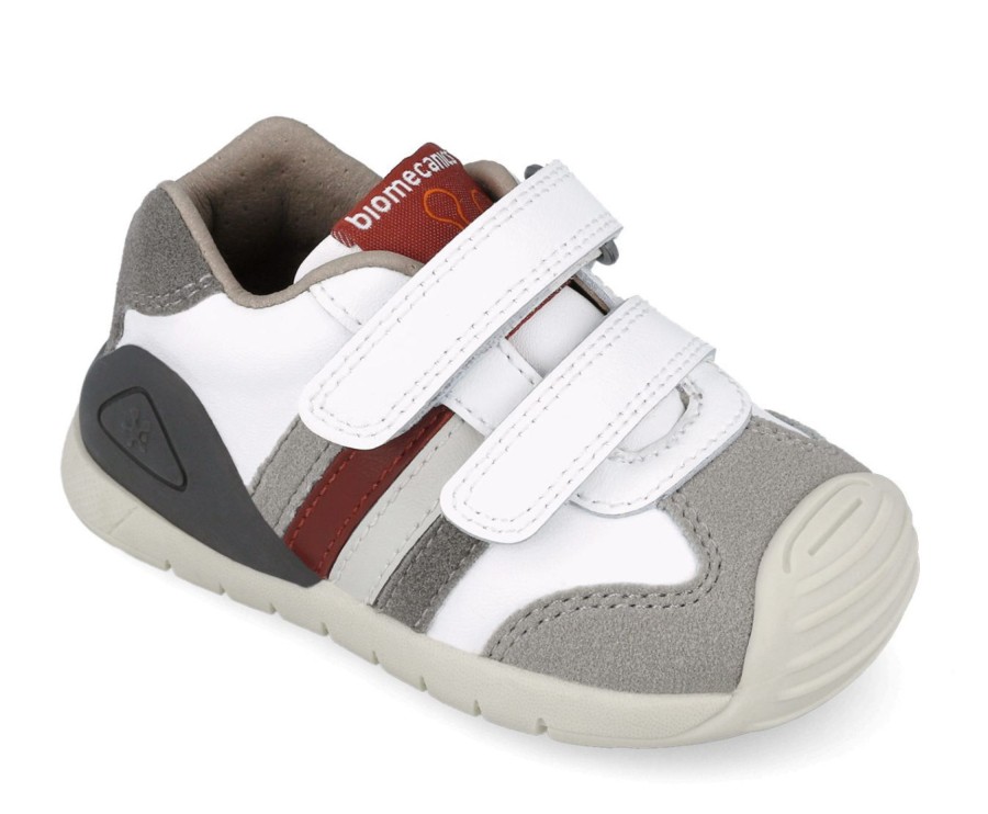 Zapatillas niño Biomecanics color blanc0 y gris con cuatro tiras multicolor calzado respetuoso con el desarrollo natural del pie para gateo y primeros de piel y cierre de tira adherente con plantilla always dry