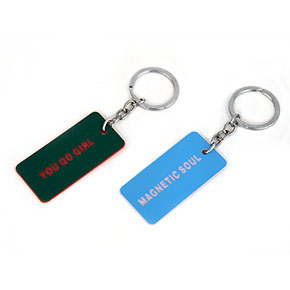 PACK OF 2 GREEN AND BLUE BADGE KEYCHAINS HF - Item1