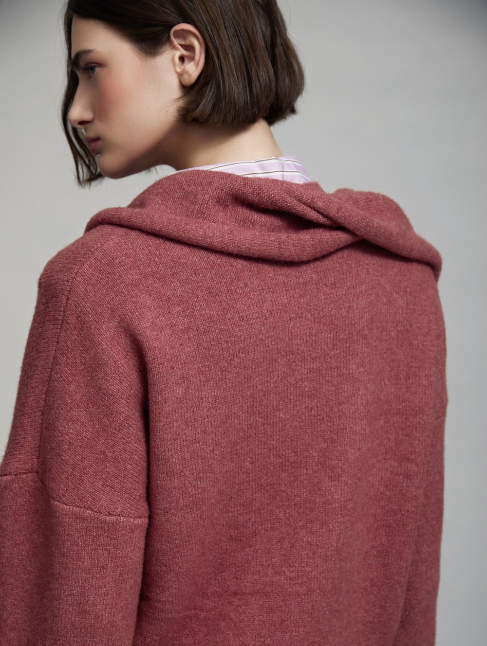 Sweater with gold brooch scarf
