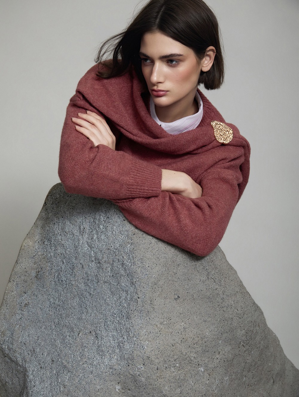 Sweater with gold brooch scarf