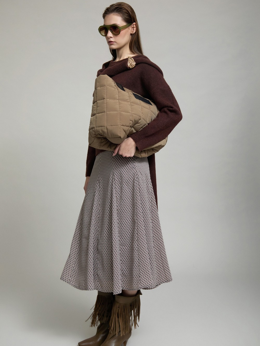 Sweater with gold brooch scarf