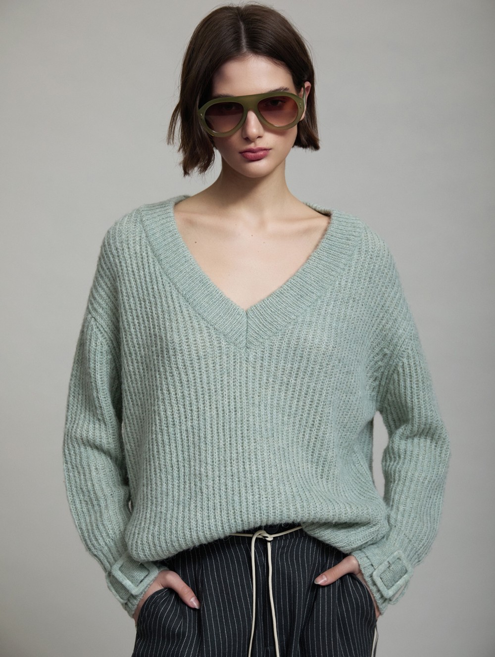 V-neck sweater buckle