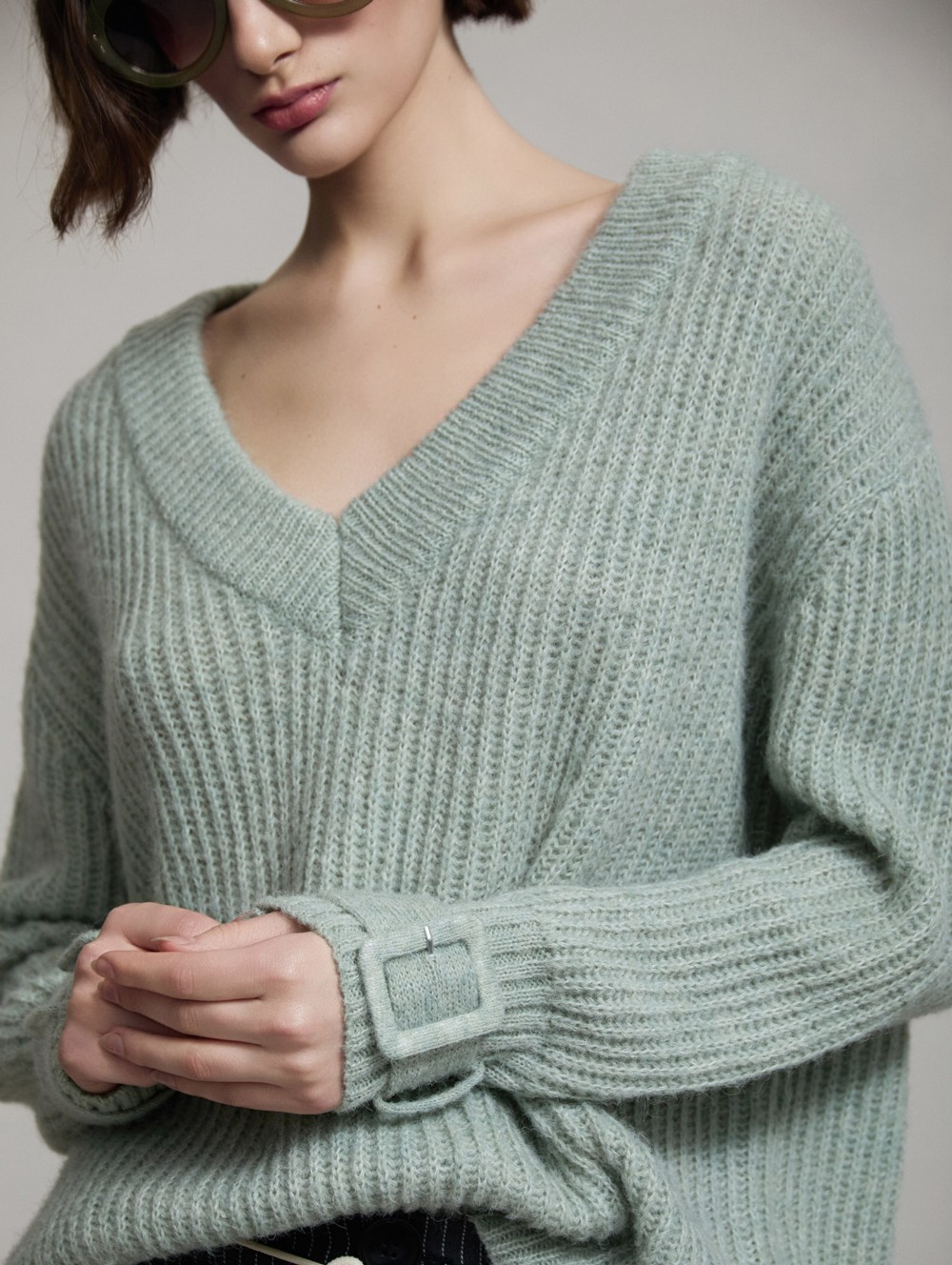 V-neck sweater buckle