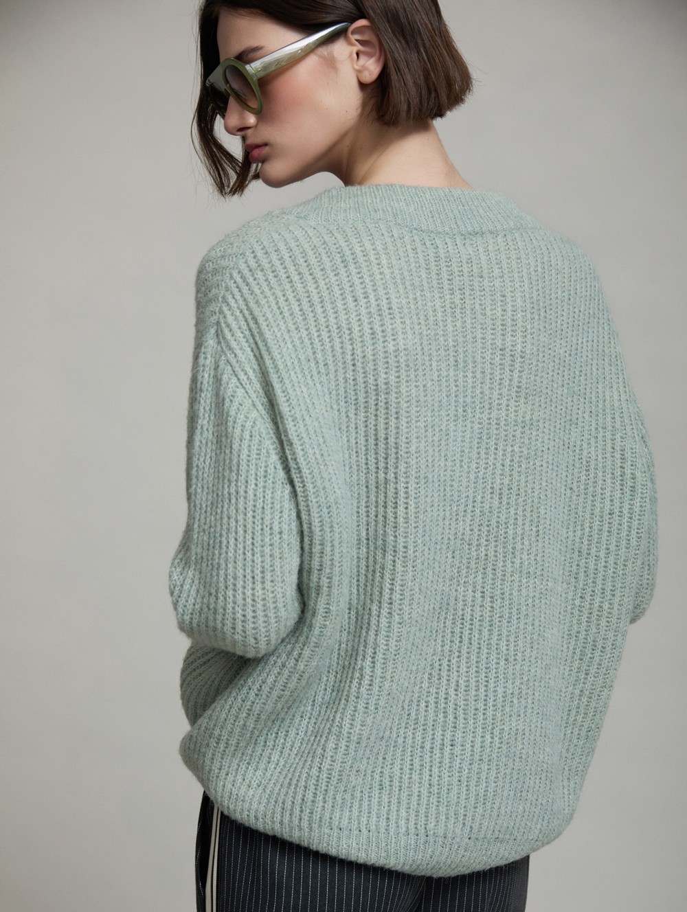 V-neck sweater buckle
