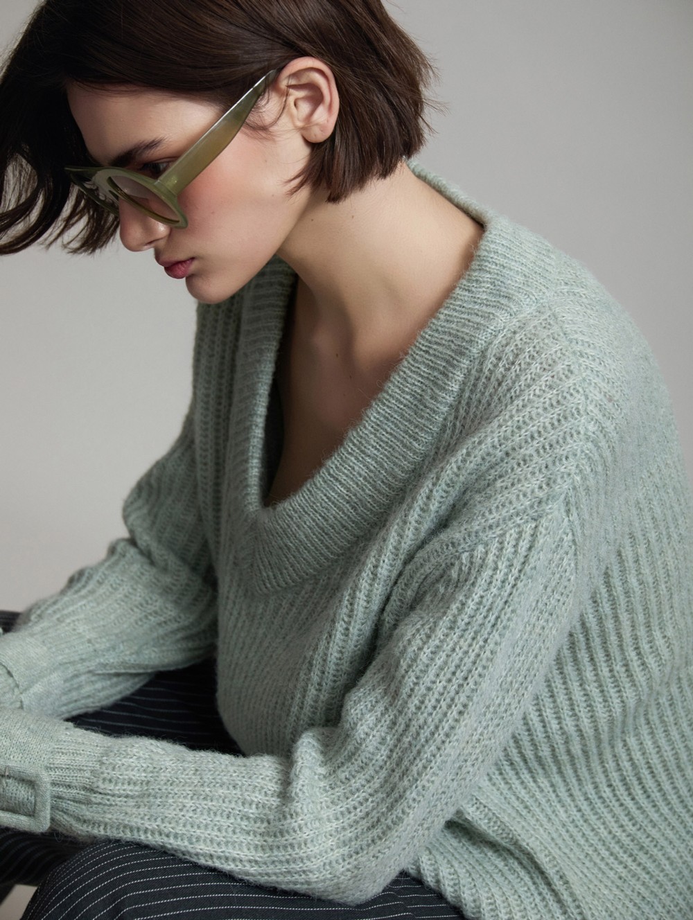 V-neck sweater buckle