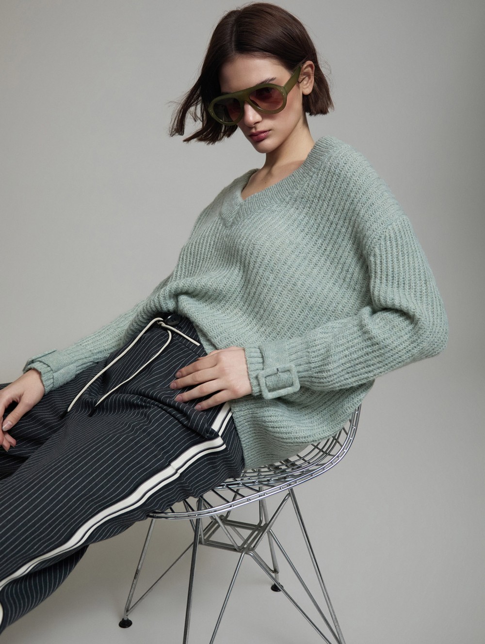 V-neck sweater buckle