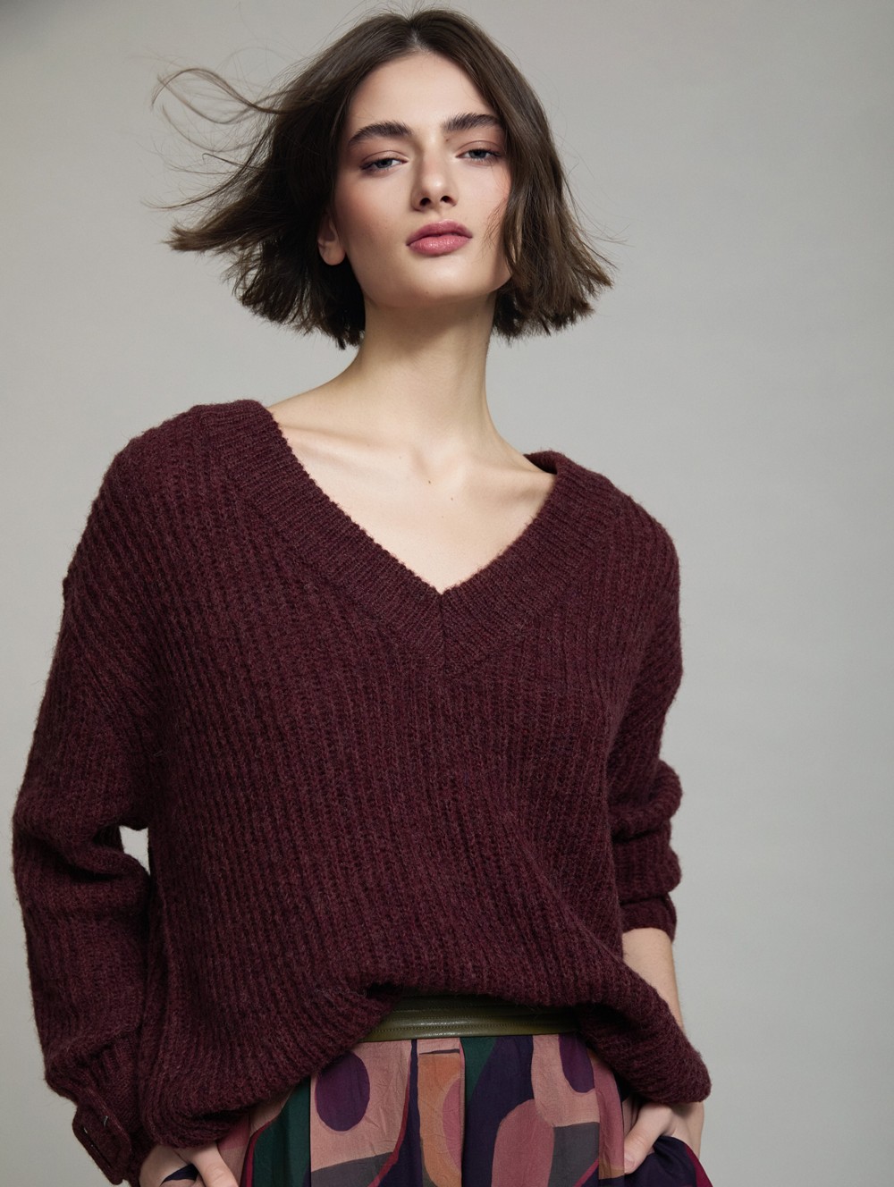 V-neck sweater buckle