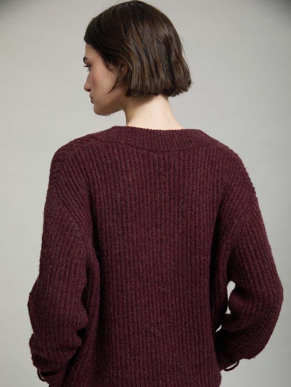 V-neck sweater buckle