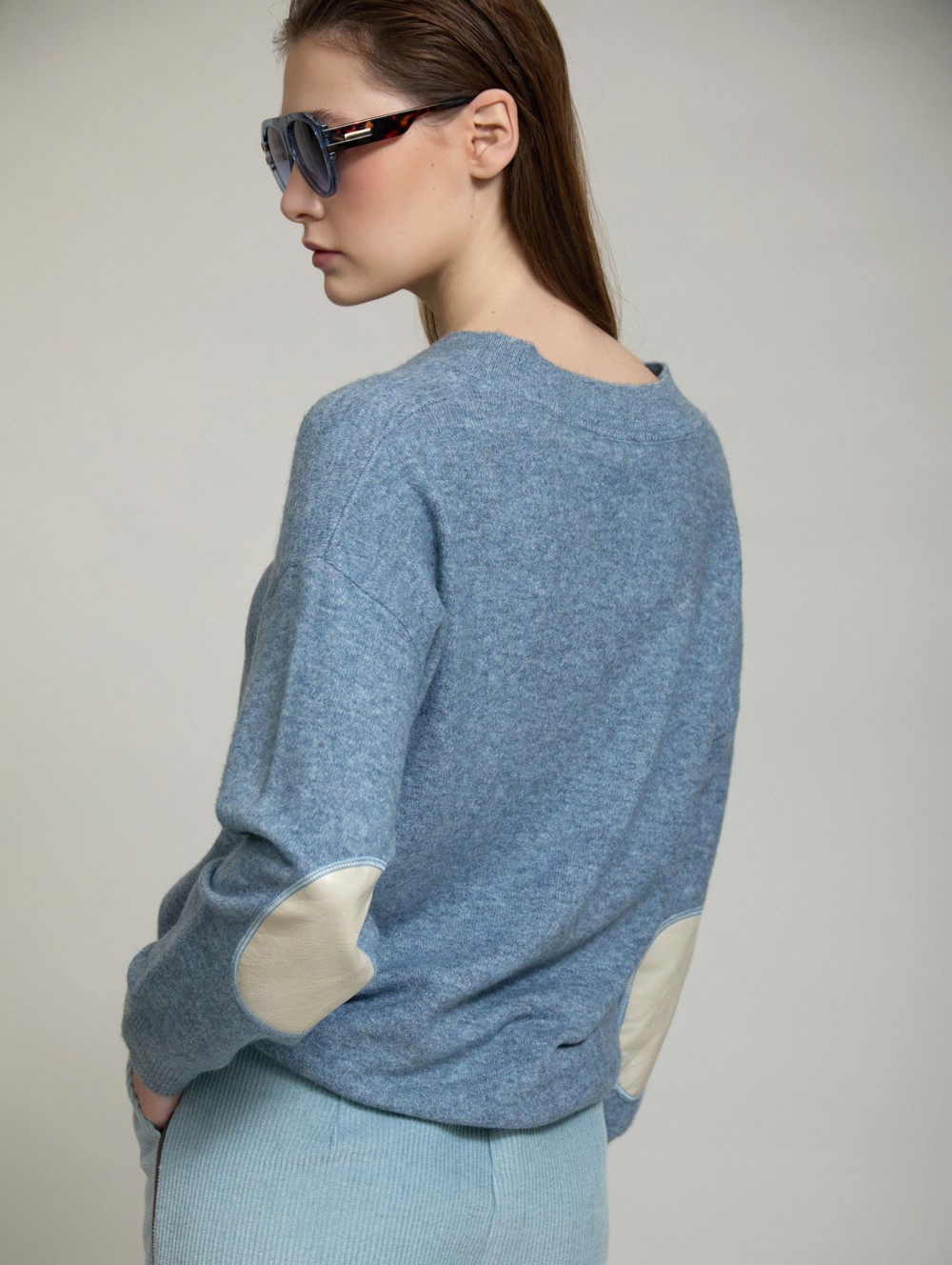 Sweater with faux leather