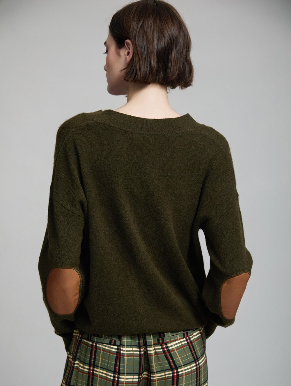 Sweater with faux leather