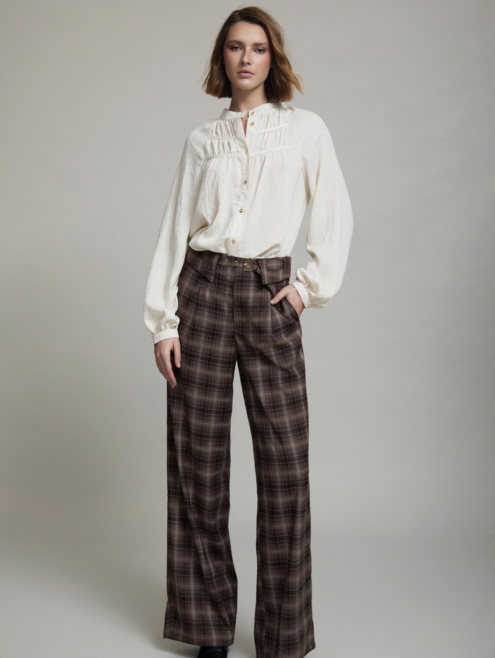 Checked belt-detail trousers