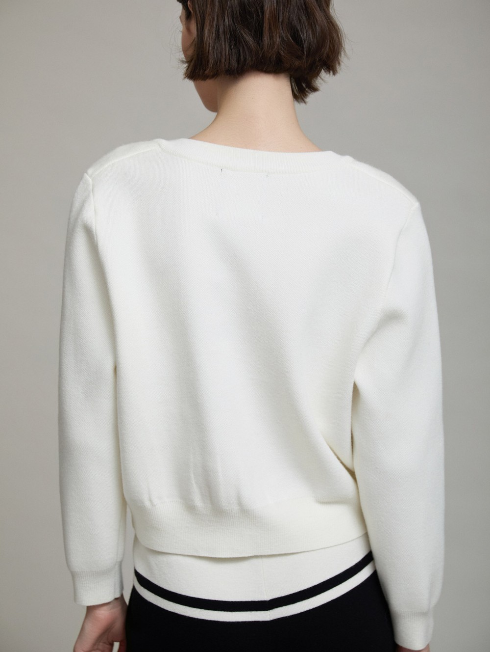 Knit jacket with button contrast