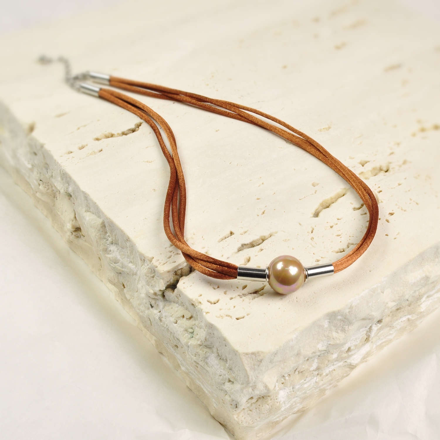 Silk cord Necklace with a copper colour pearl. 1