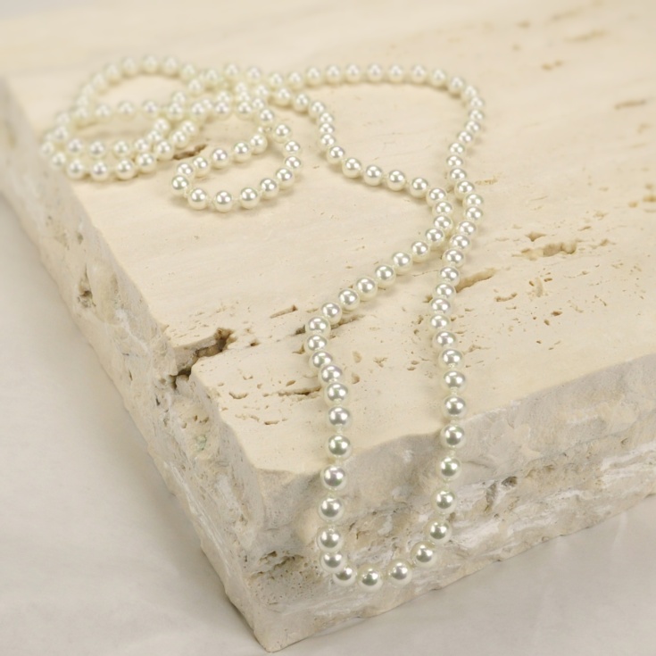 Endless classic 6 mm. pearls necklace.