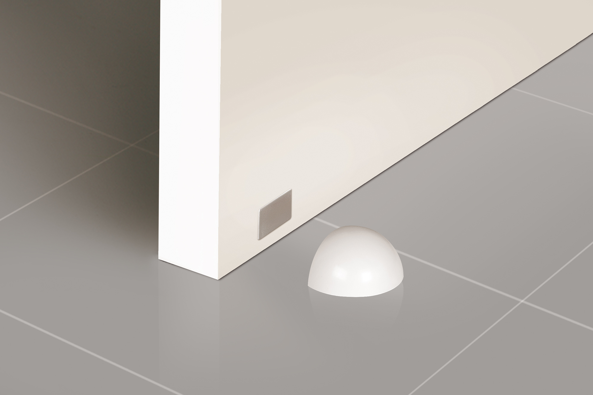 Retenedor de puerta con imán adhesivo con acabado blanco. Dimensiones: 51x39x26 mm - Ítem1